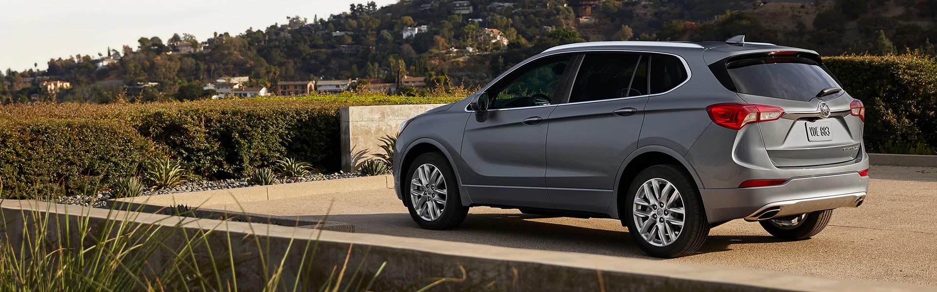 A silver Buick in a driveway