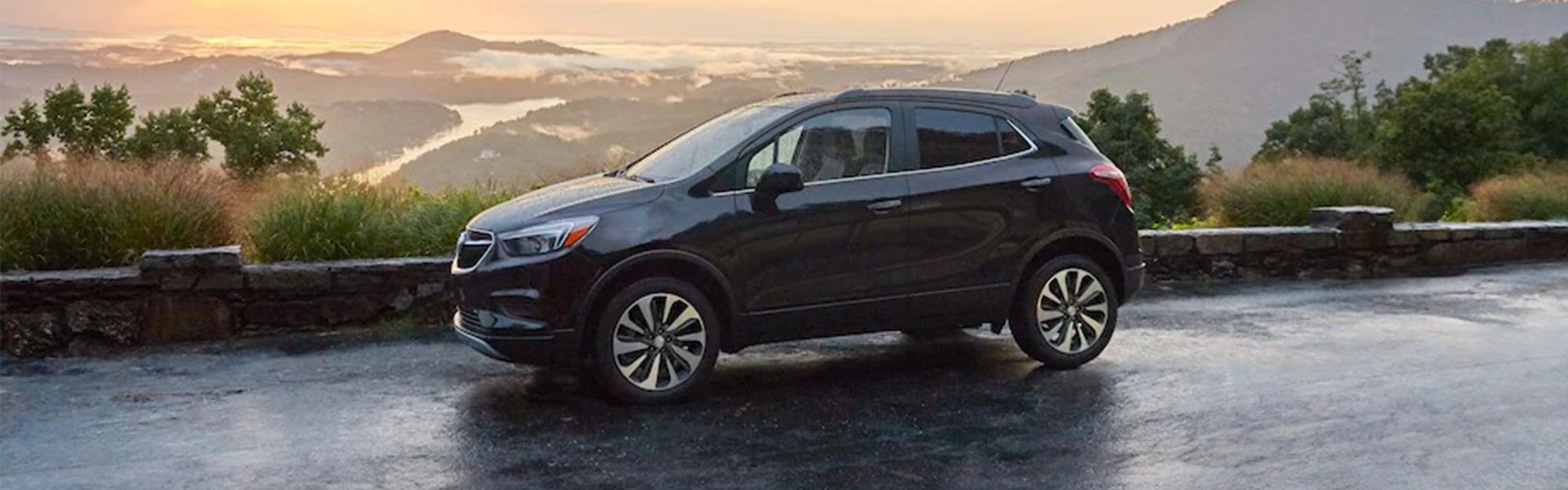 A black Buick Encore parked at an overlook
